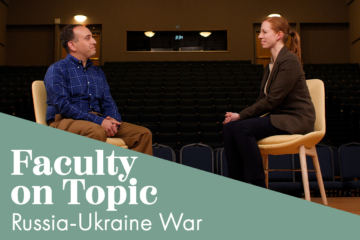Two people sit on chairs and face each other. A graphic overlay says Faculty on Topic: Russia-Ukraine War