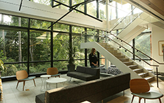 Inside stairwell looking out large glass windows of the Tyler McLeod Wellness Center
