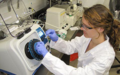 Vials of ticks are loaded into the bead beater in the Integrated Science Center