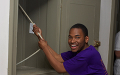 student ringing the Wren bell on the last day of classes