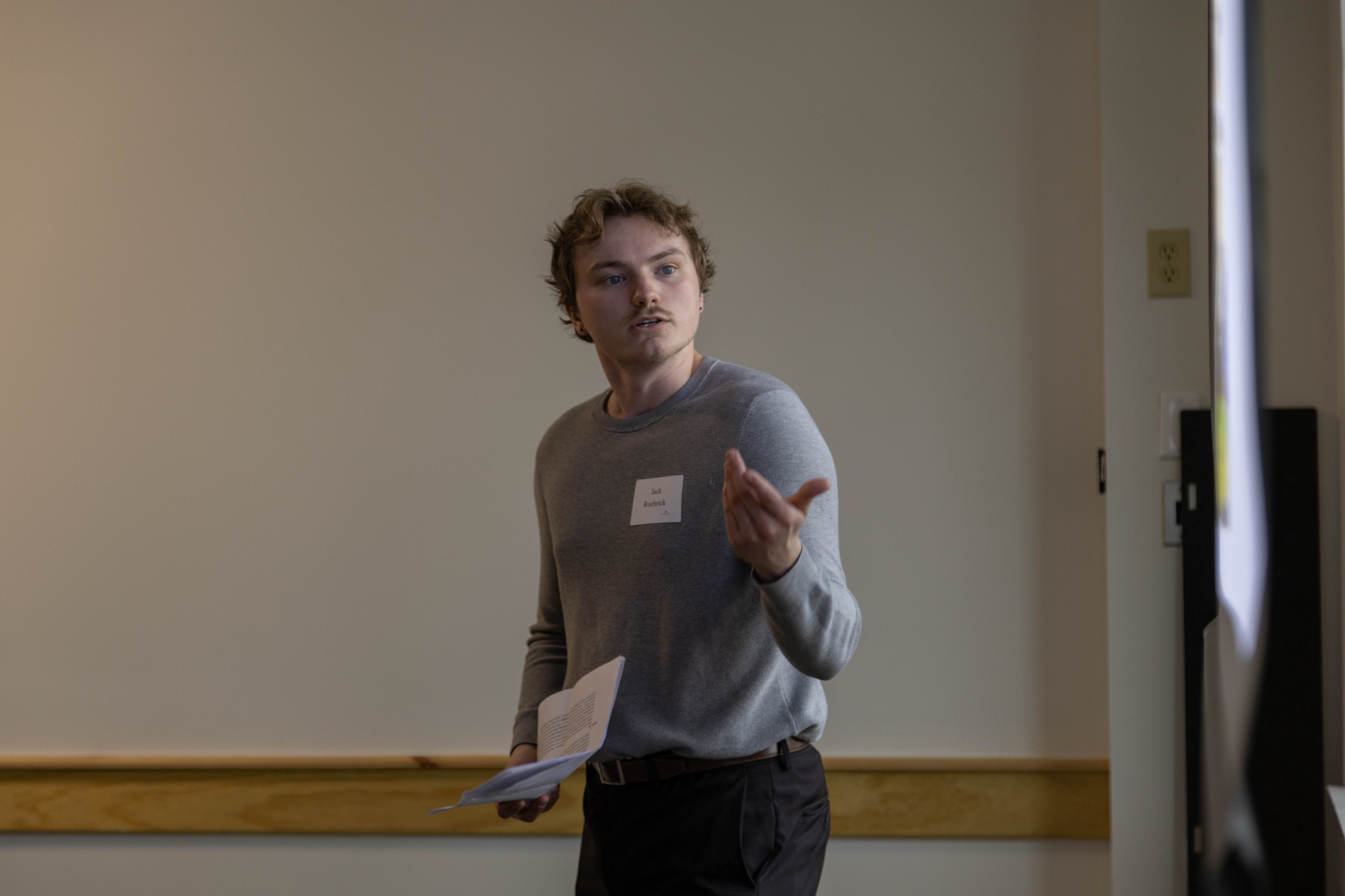 Senior Jack Roehrick, an economics and psychology double major, presents on "The built environment and personality: Preferences for place and modes of transportation" April 4 in Sadler Center. (Photo by Tess Willett)