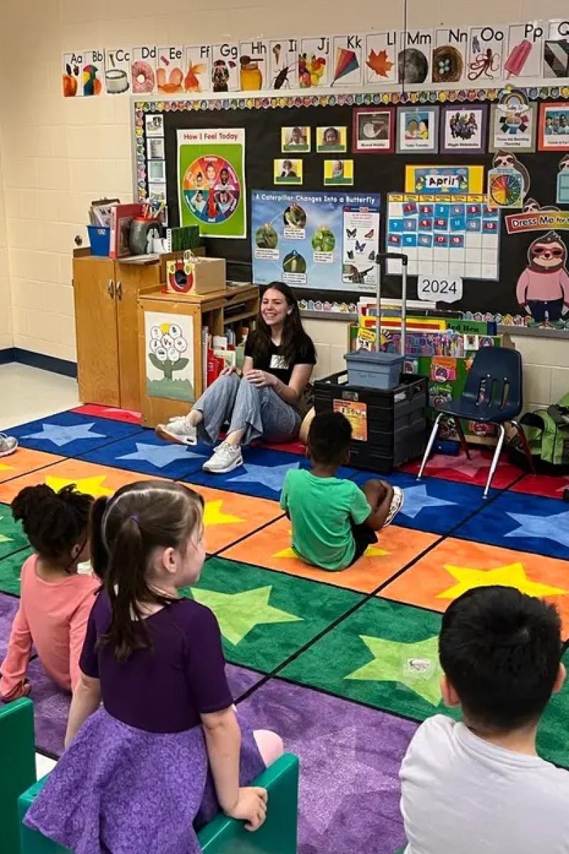 Emma Smith '25, a biology major and aspiring pediatric physician, leads class as part of her Woody Internship in Early Childhood Music Education last year. (Photo by Anthony Williams)