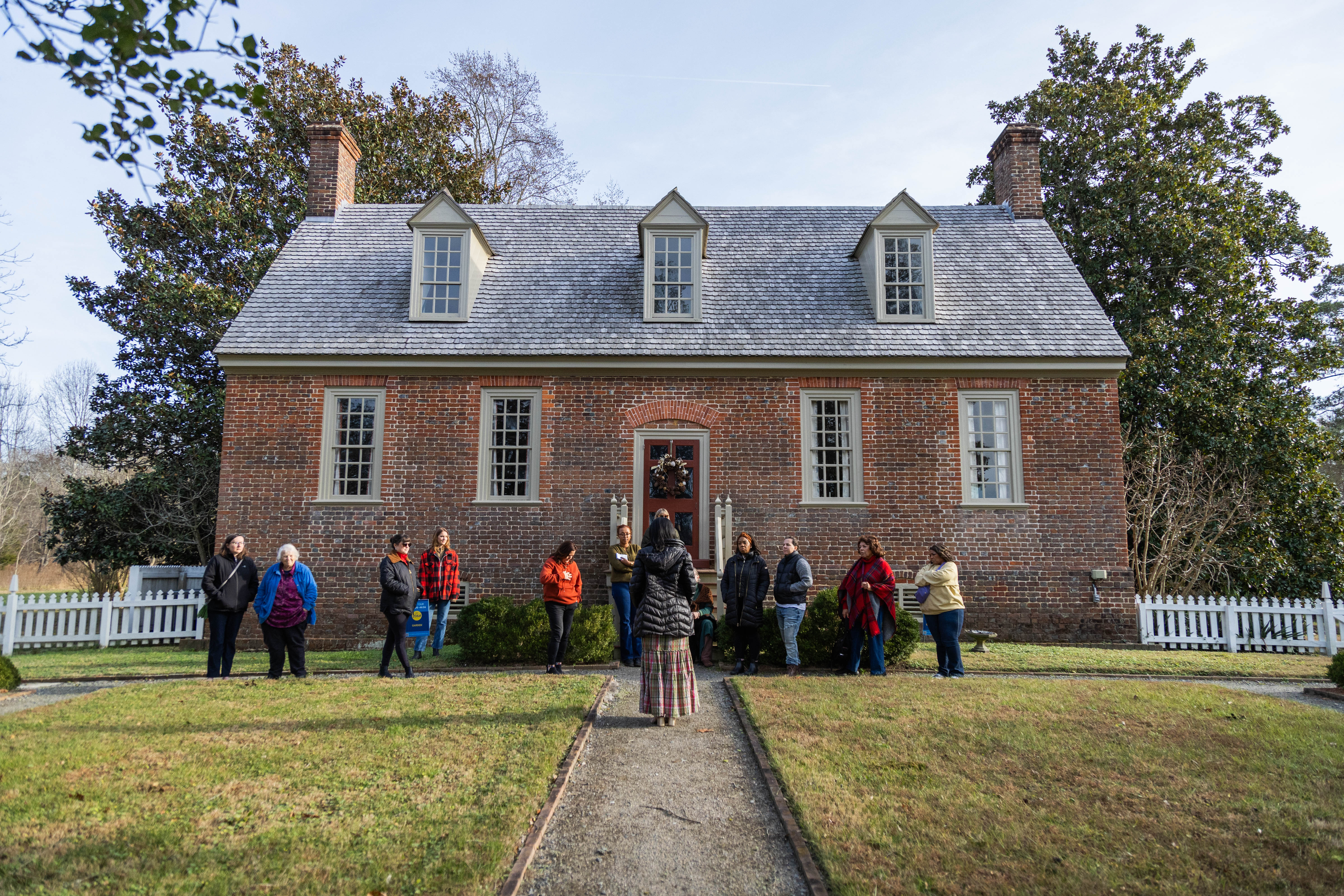 Faith Page '26 concludes a tour last December in the gardens behind Smith's Fort, a museum operated by Preservation Virginia. (Photo by Tess Willett)