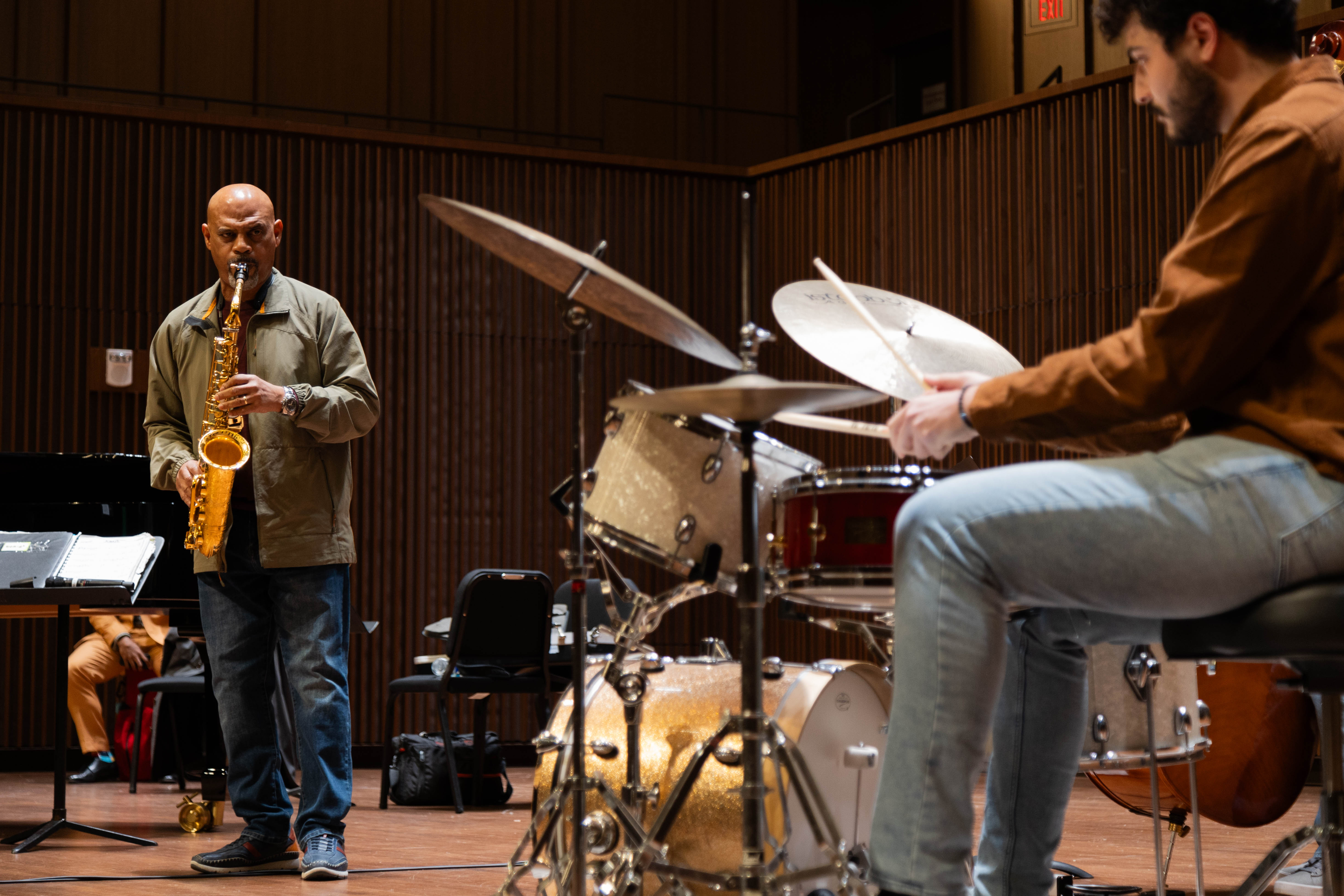 Learning through doing. Drummer Jaden Shahin '25 (right) listens and plays alongside jazz legend Steve Wilson (left) in a Charles Center-sponsored Jan. 25 masterclass in W&M Arts Center Concert Hall. (Photo by Tess Willett)