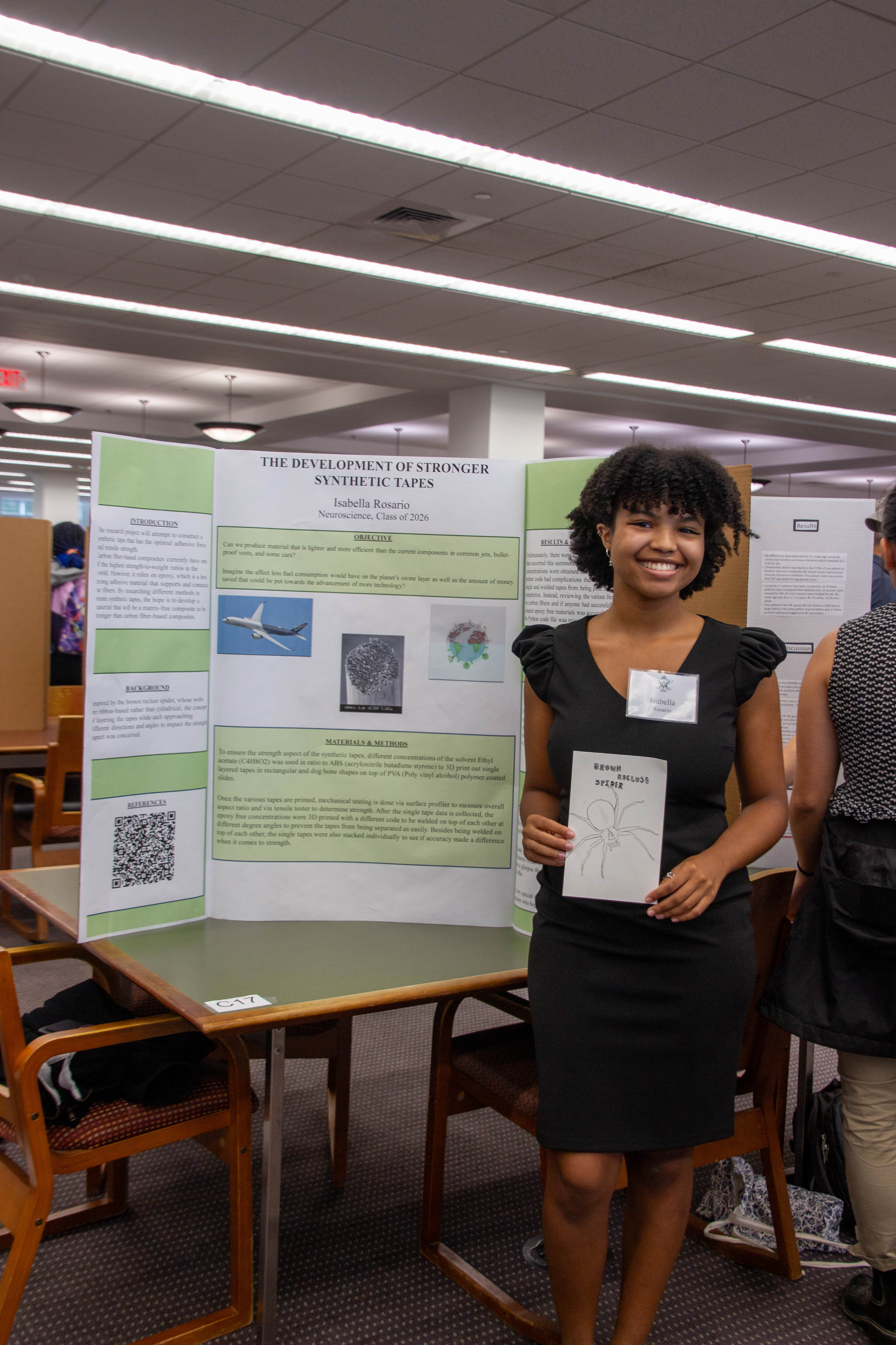 Isabella Rosario ’26, a neuroscience major in the pre-med program, displayed her groundbreaking work with brown recluse spiders. (photo by Tess Willett)