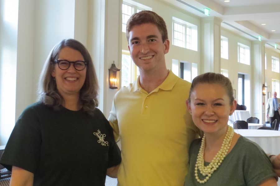 Seniors Pam Hawkes, Isaac Alty, and Katy Knortz assisting in CAMWS check-in