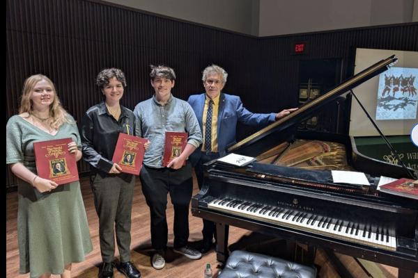 Russian Studies Students next to piano