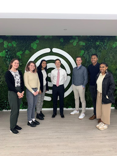 Geoff Horsfield (W&M MPP alum, center) and Austin Yager (W&M alum, center right) meet with students at the Environmental Working Group. 