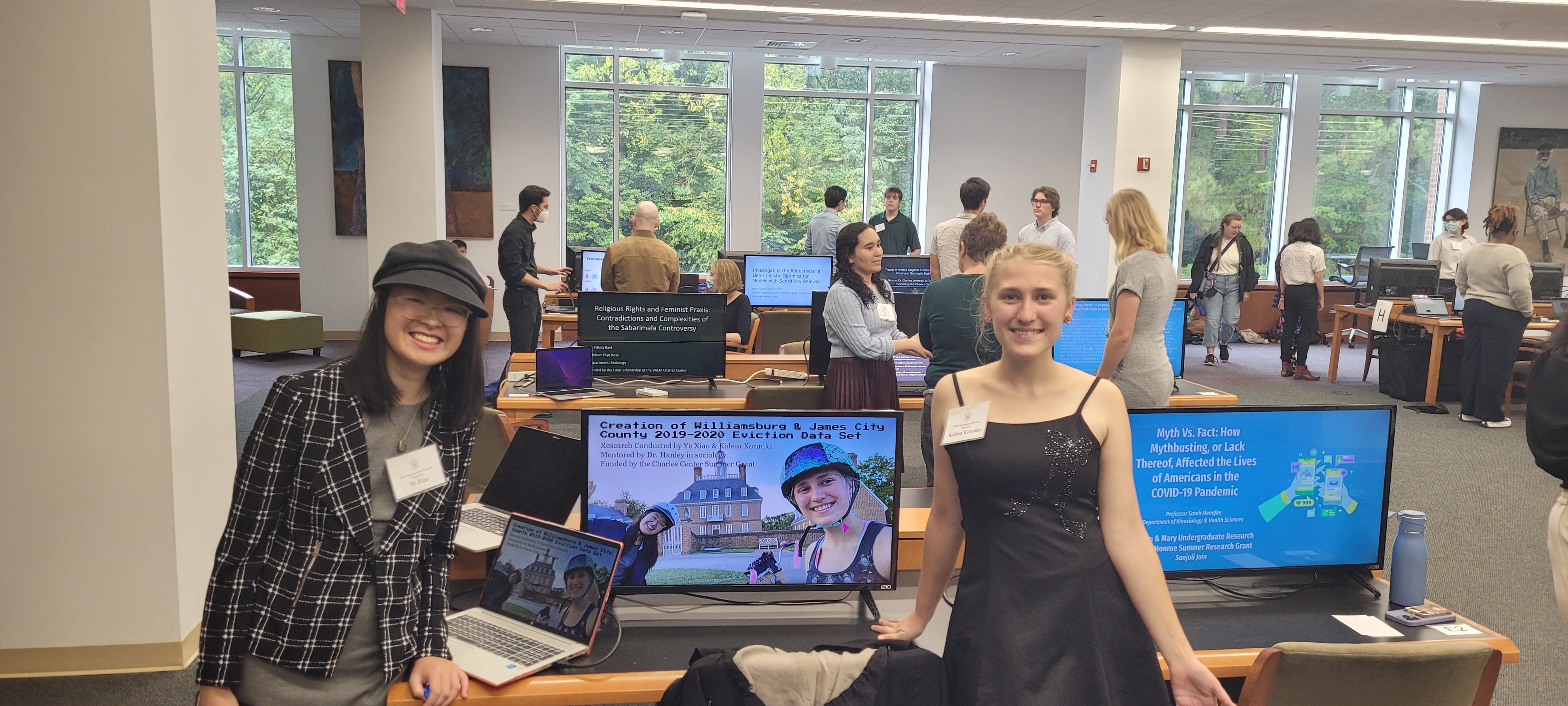 Sharpe Scholars Ye Xiao (left) and Kaleea Korunka (right) presenting their research on eviction in James City County