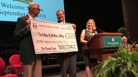 President Taylor Reveley accepts the check from the Parent and Family Council. (Courtesy photo)