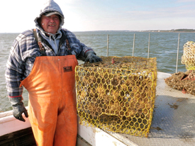 Waterman EC Hogge with a derelict crab pot retrieved from the York River