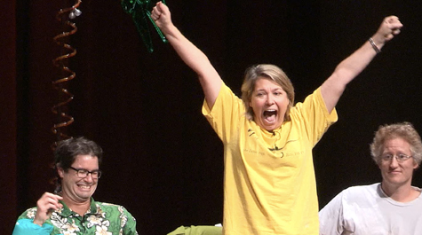 Professor of Geology Rowan Lockwood, defending the natural and computational sciences, urges the audience to cheer louder following her presentation.