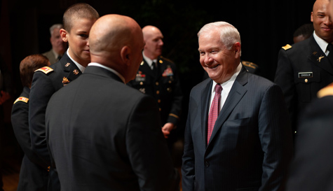 Gates talks with ROTC cadets at a commissioning ceremony. (Photo by Stephen Salpukas)