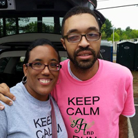 Davis poses with his wife Reneka