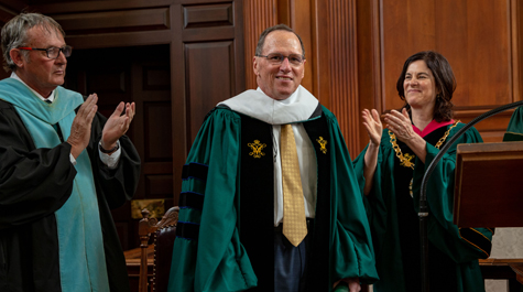 John Gerdelman ’75 (center) receives an honorary degree. (Photo by Skip Rowland '83)