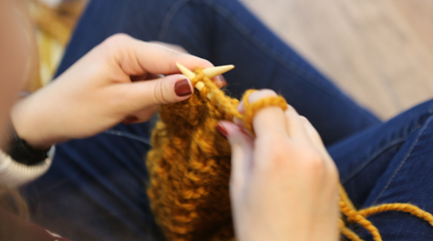 Some members of the class use needles while others with less experience start with looms. (Photo by Stephen Salpukas)