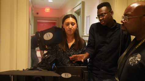 Isaac Davis '20 (center) reviews a scene with two other members of the production. (Courtesy photo)