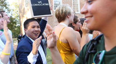 Student high-fives another student