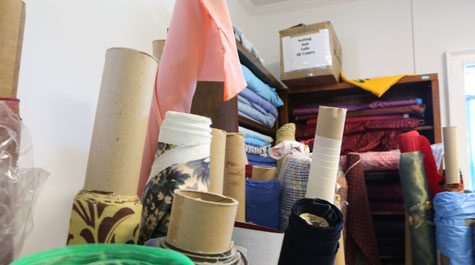 Bolts of cloth stored vertically
