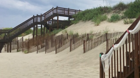 Steps lead down into sand