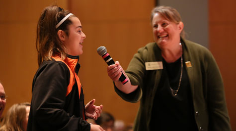 A young fan asks Jill Ellis a question