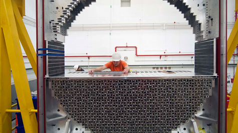 A researcher assembles lead glass rods during the installation of Jefferson Lab’s upgrade for its Continuous Electron Beam Accelerator. 