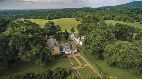 An aerial view of Highland surrounded by green fields and trees
