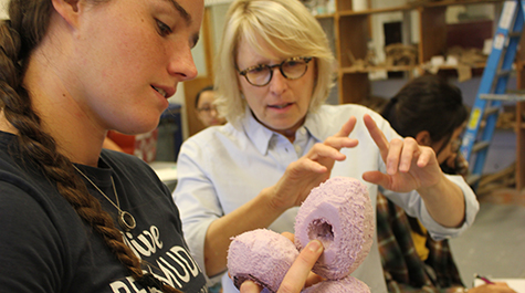 William & 玛丽 art professor Elizabeth Mead discusses a model sculpture design with her student Saylor Zechman 
