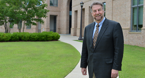 Spencer Niles stands in front of the School of Education