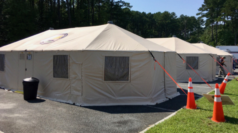 Tents tied to the ground with orange cables