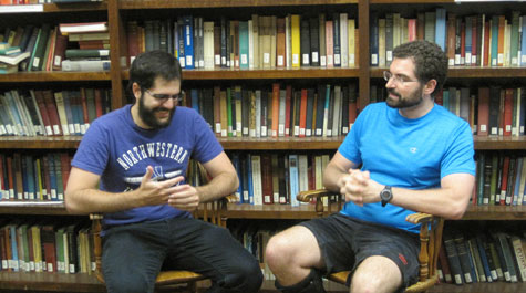 Felipe Medeiros (left) and Chris Tucker sitting in chairs