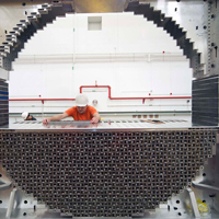 A researcher assembles lead glass rods during the installation of Jefferson Lab’s upgrade for its Continuous Electron Beam Accelerator. 