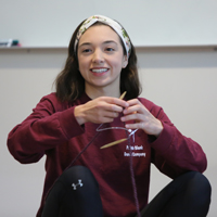 A student knits