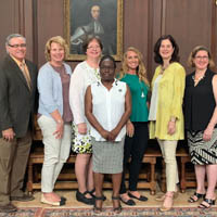 Members of Procurement Services pose for a photo together in the Great Hall