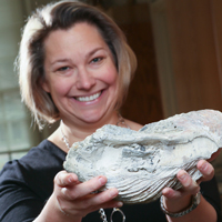 Rowan Lockwood displays a fossilized oyster shell 
