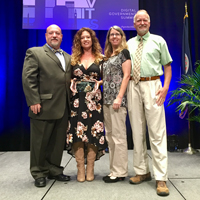 Four members of the WetCAT team accept the Governor’s Award