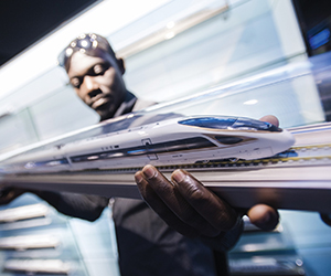 A railway executive from Ghana watches a model of a Fuxing bullet train at a training base for high-speed railway staff in Wuhan, in central China’s Hubei Province. (Courtesy photo)