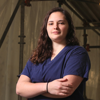 Ali Crawford posing with arms crossed