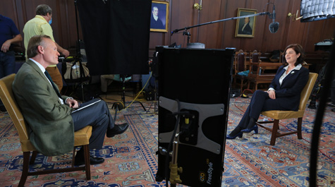 John Dickerson and Katherine Rowe sit in chair in the Great Hall