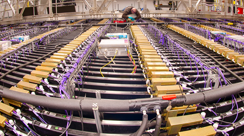 A technician works on the installation of the far detector 