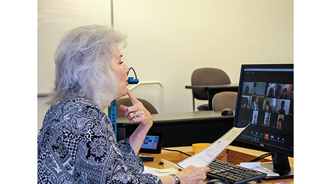 Carlene Klein shows her students in China the way she uses her lips and teeth to pronounce different consonants