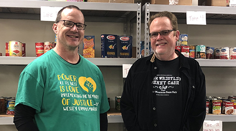 Max Blalock of the Wesley House and Tim Grayson, W&M Dining Executive Chef pause after assessing food pantry supplies