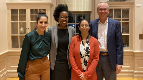 Four people pose for a photo together