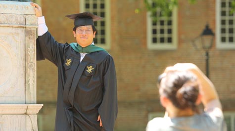 An adult wearing academic regalia 