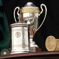 A trophy and other awards on a table