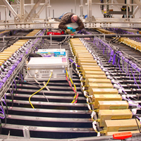 A technician works on the installation of the far detector 