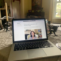 Laptop screeen showing Katherine Rowe with other guests shown down side of screen