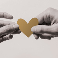 Illustration of hands holding a paper heart