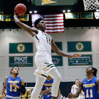 Nathan Knight flying through the air to dunk the basketball