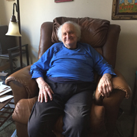 Larry LaShan seated in recliner